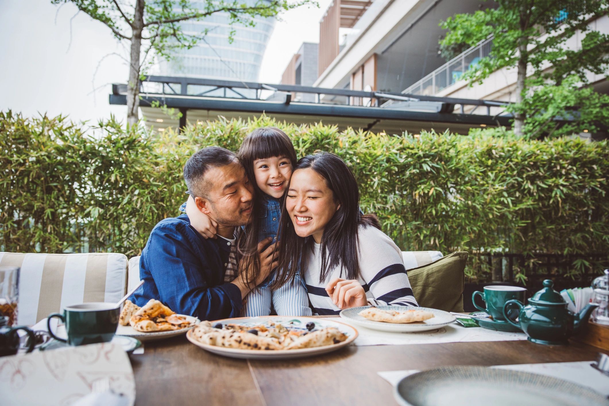 family enjoying pizza restaurant